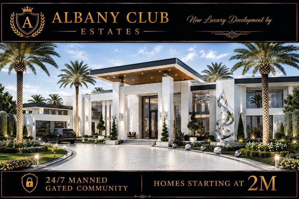 Modern luxury home — grand entrance with geometric driveway at sunset